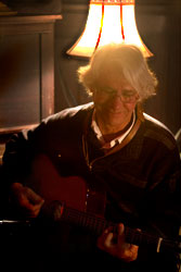 Willy plays guitar at Nietzsches